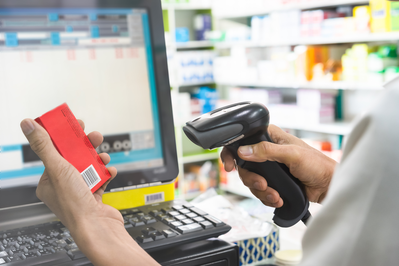 pharmacist scanning medication