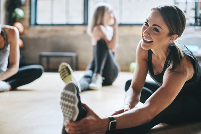 fit young woman stretching