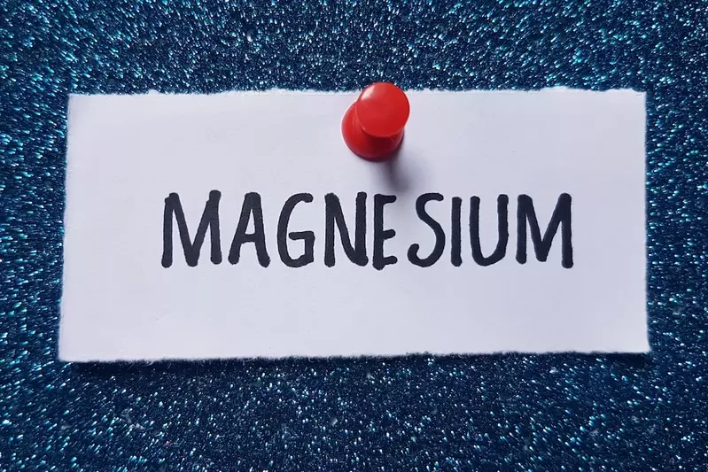 Magnesium sign on wall